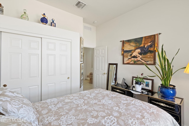 bedroom featuring visible vents, a closet, and tile patterned floors
