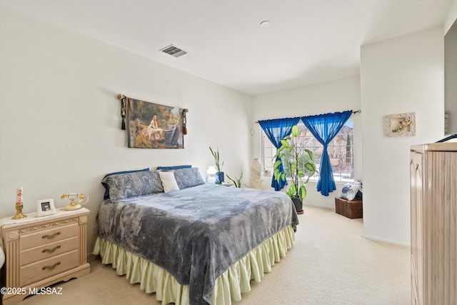 bedroom with light carpet and visible vents