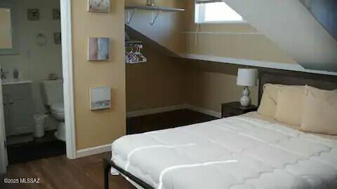 bedroom featuring dark hardwood / wood-style flooring