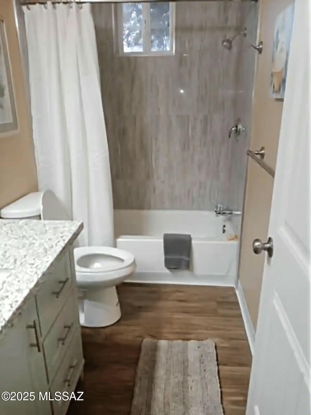 full bathroom with vanity, wood-type flooring, shower / bath combo, and toilet