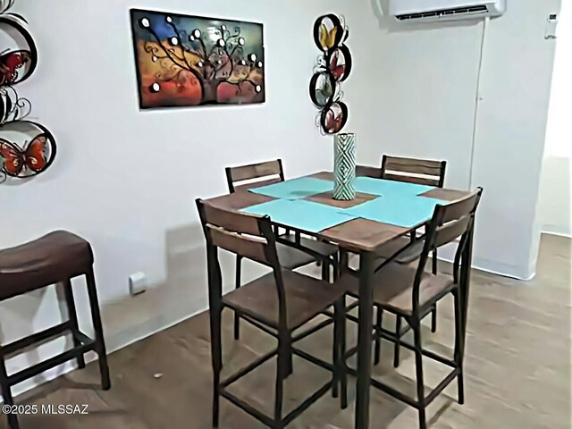 dining room with a wall mounted air conditioner