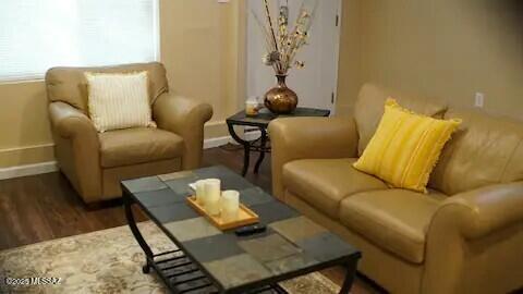 living area featuring dark hardwood / wood-style floors