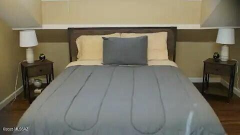 bedroom featuring dark hardwood / wood-style floors