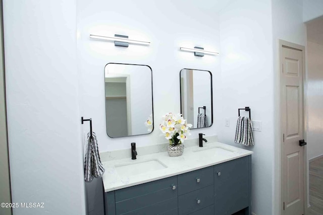 bathroom with double vanity and a sink