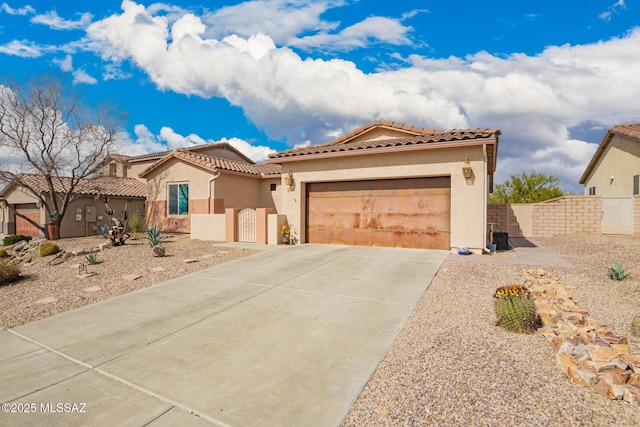 mediterranean / spanish-style home with a garage