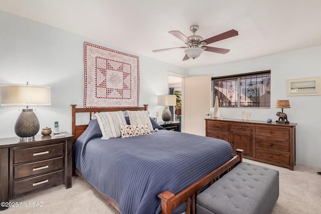 bedroom featuring light colored carpet and ceiling fan