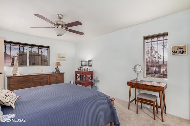 carpeted bedroom featuring ceiling fan