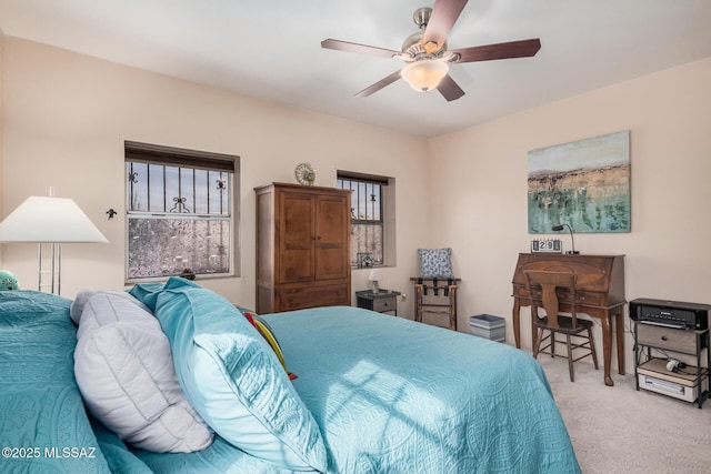 carpeted bedroom featuring ceiling fan