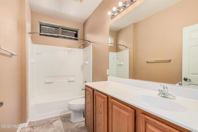 full bathroom featuring vanity, tile patterned flooring, shower / washtub combination, and toilet