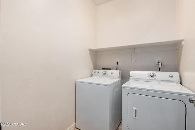 washroom featuring washing machine and dryer