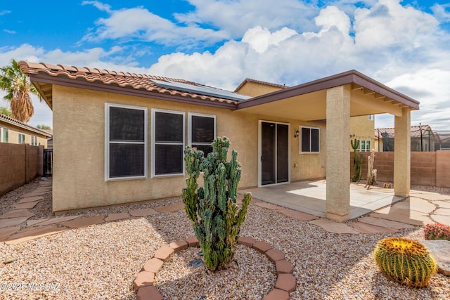 rear view of house with a patio area