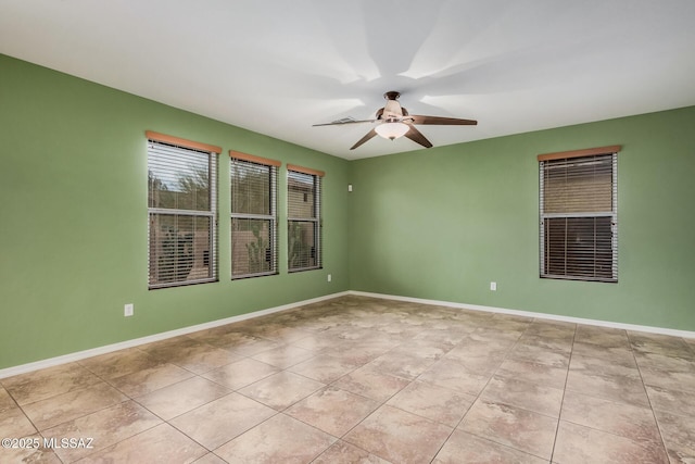 unfurnished room featuring light tile patterned floors and ceiling fan