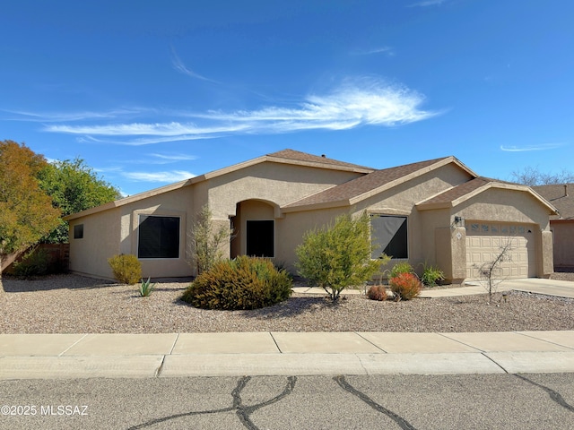 single story home featuring a garage