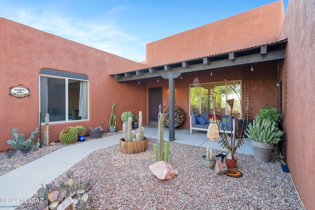 property entrance with a patio area