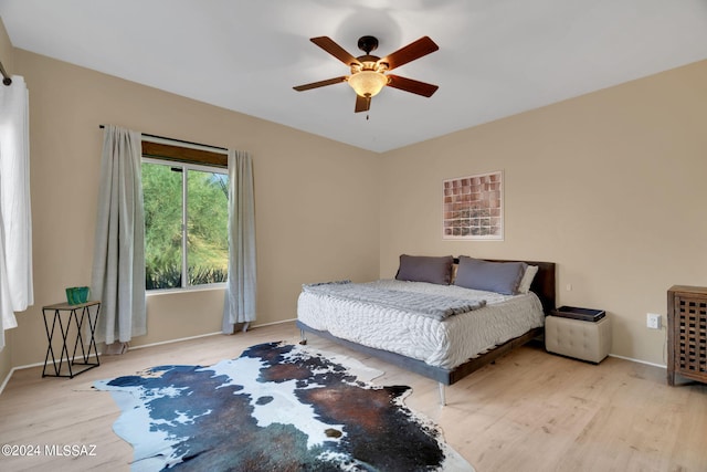 bedroom featuring ceiling fan and light wood-type flooring