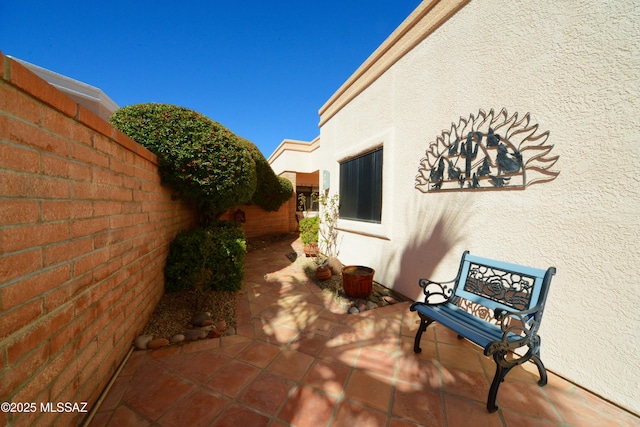 view of patio / terrace with fence