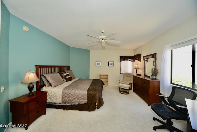 bedroom featuring a ceiling fan and light colored carpet