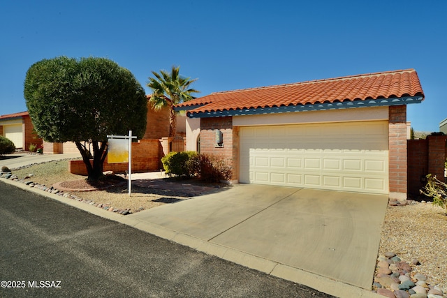 view of front facade featuring a garage, a tiled roof, brick siding, and fence