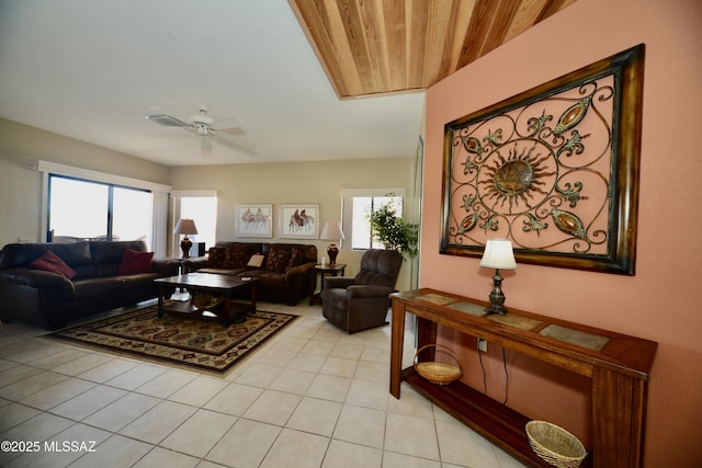 living room with light tile patterned floors and a ceiling fan