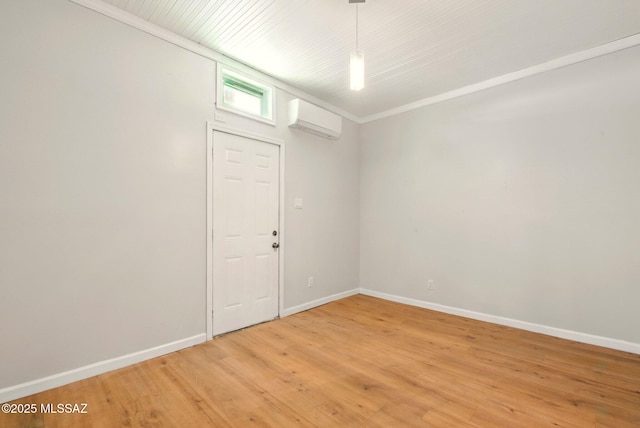 816 W 11th St, Safford, AZ 85546 - unfurnished room with an AC wall unit, light wood-type flooring, and baseboards