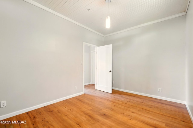 816 W 11th St, Safford, AZ 85546 - spare room featuring light wood-type flooring, baseboards, and crown molding