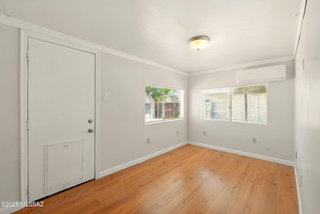 816 W 11th St, Safford, AZ 85546 - entrance foyer featuring a wall mounted AC, light wood-style floors, crown molding, and baseboards