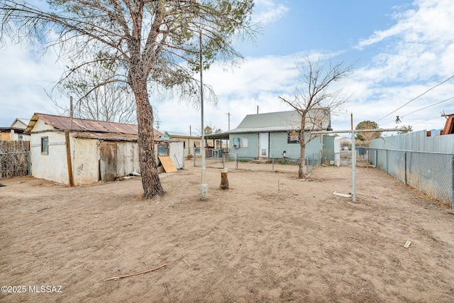 back of property with a shed