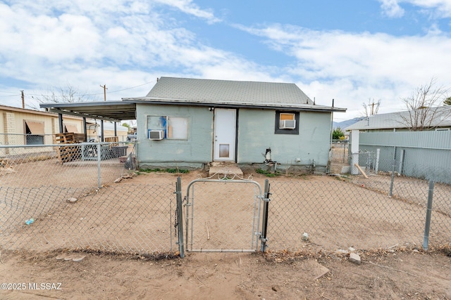 rear view of house featuring cooling unit