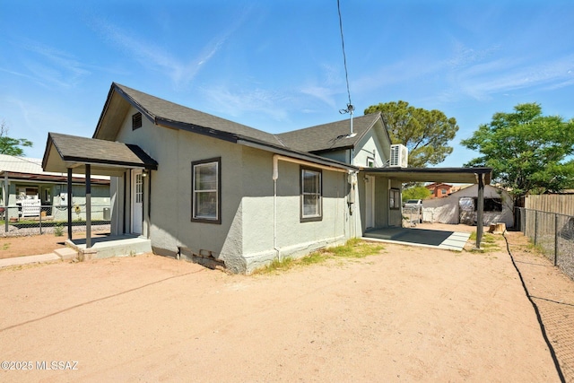 816 W 11th St, Safford, AZ 85546 - view of property exterior featuring fence, an attached carport, stucco siding, driveway, and a patio