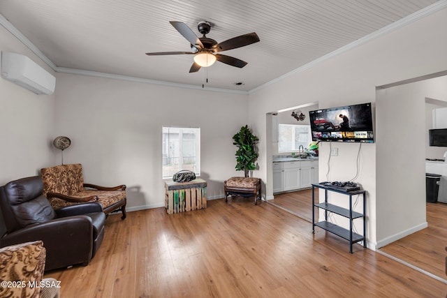 living area featuring a wall mounted air conditioner, crown molding, sink, and light wood-type flooring