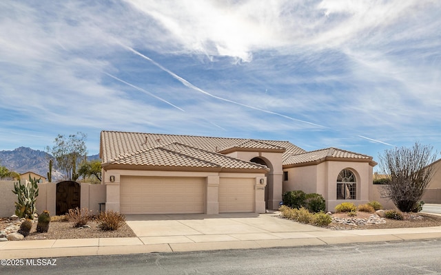 mediterranean / spanish-style house featuring a garage