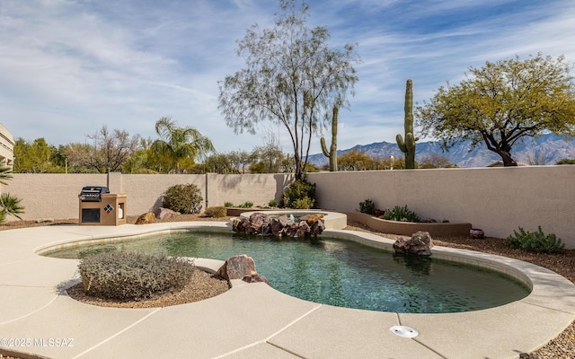 view of pool featuring a mountain view