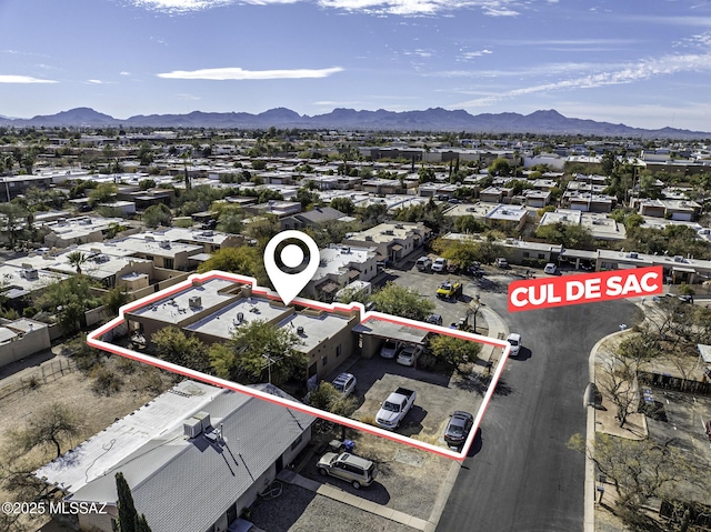 birds eye view of property with a mountain view