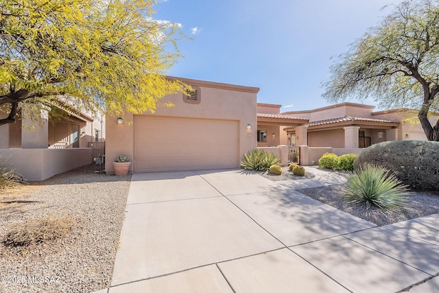 adobe home featuring a garage