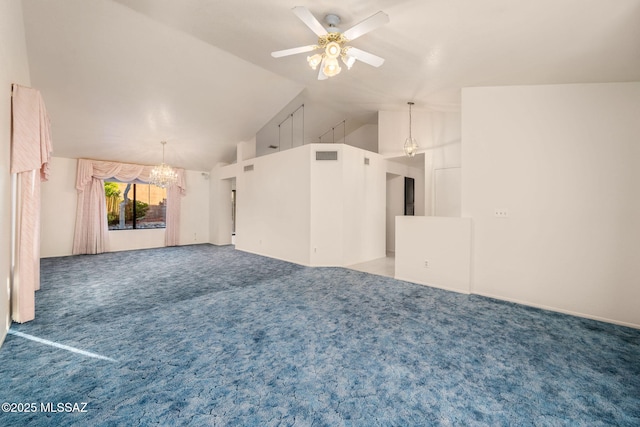 unfurnished living room featuring ceiling fan with notable chandelier, high vaulted ceiling, and carpet flooring