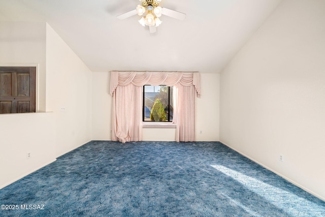 carpeted empty room featuring lofted ceiling and ceiling fan