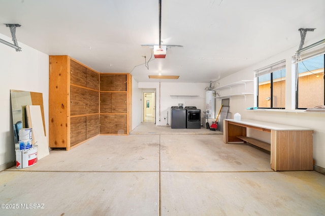 garage featuring a garage door opener, gas water heater, and washing machine and dryer