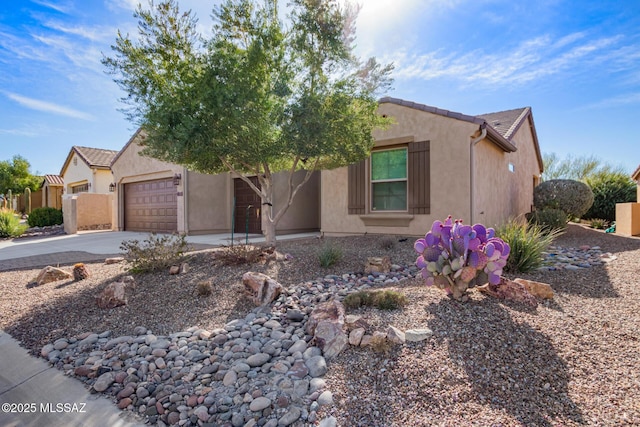 60437 E Arroyo Vista Dr, Oracle, AZ 85623 - view of front facade with driveway, stucco siding, and a garage