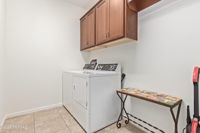 60437 E Arroyo Vista Dr, Oracle, AZ 85623 - laundry room featuring cabinet space, independent washer and dryer, baseboards, and light tile patterned flooring