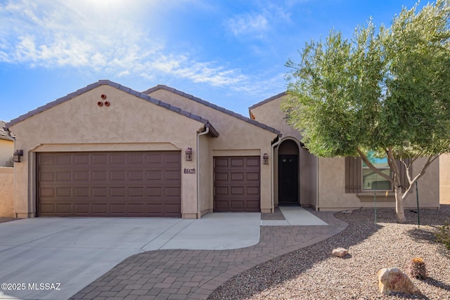 60437 E Arroyo Vista Dr, Oracle, AZ 85623 - view of front of property with a garage, stucco siding, and concrete driveway