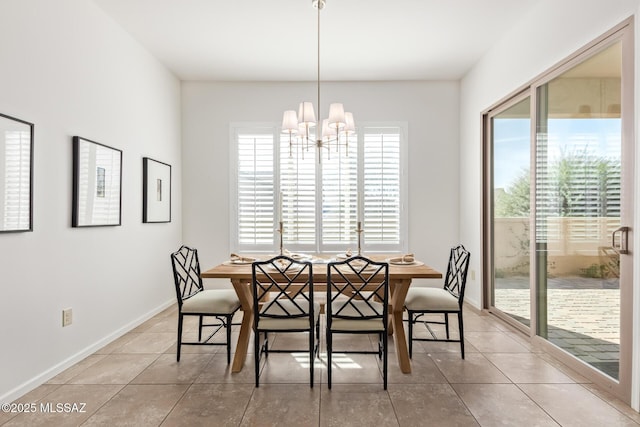 60437 E Arroyo Vista Dr, Oracle, AZ 85623 - dining area featuring a chandelier, tile patterned floors, and baseboards