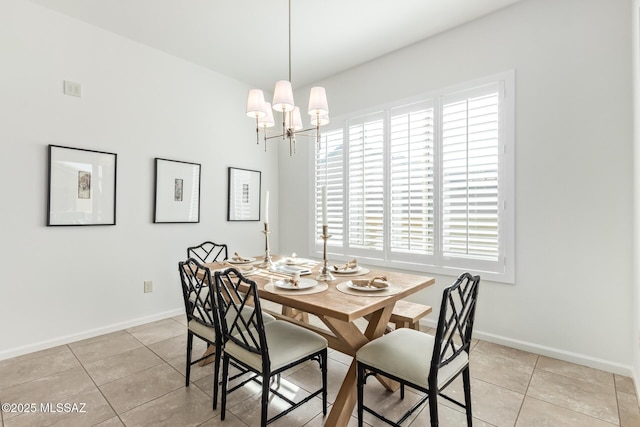 60437 E Arroyo Vista Dr, Oracle, AZ 85623 - dining space with light tile patterned floors, a chandelier, and baseboards