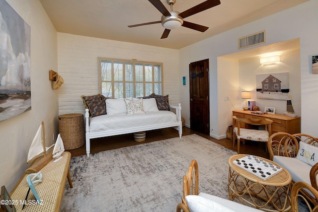 living room with hardwood / wood-style floors and ceiling fan