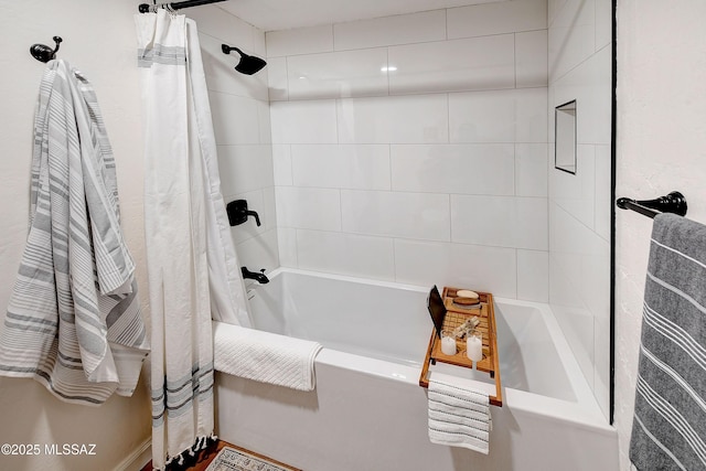 bathroom featuring shower / tub combo with curtain