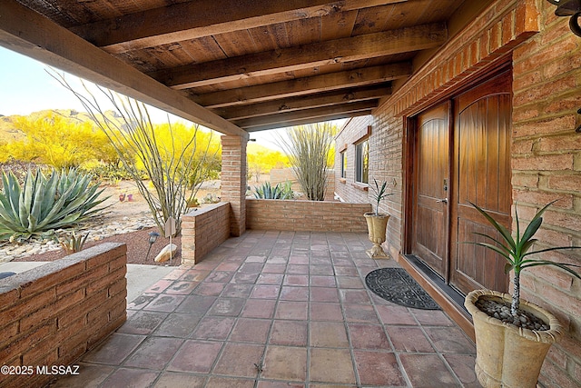 view of patio featuring a porch