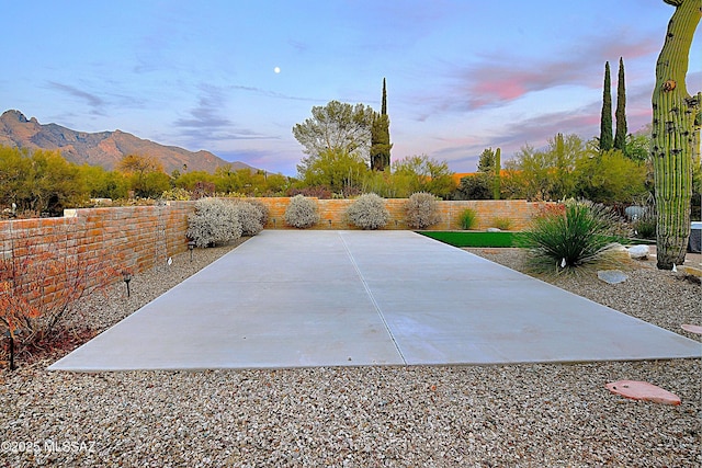 patio terrace at dusk with a mountain view