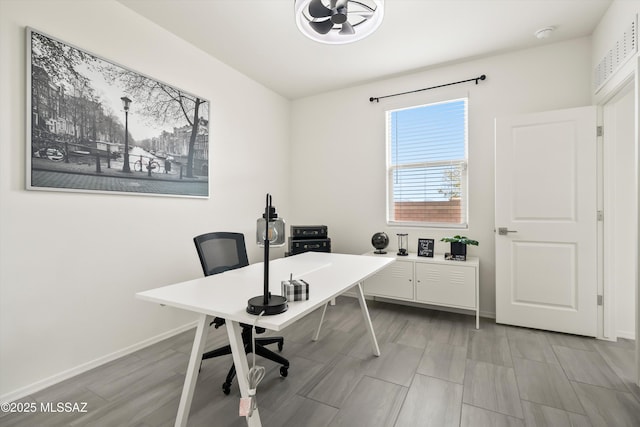 office area with light wood-type flooring and baseboards