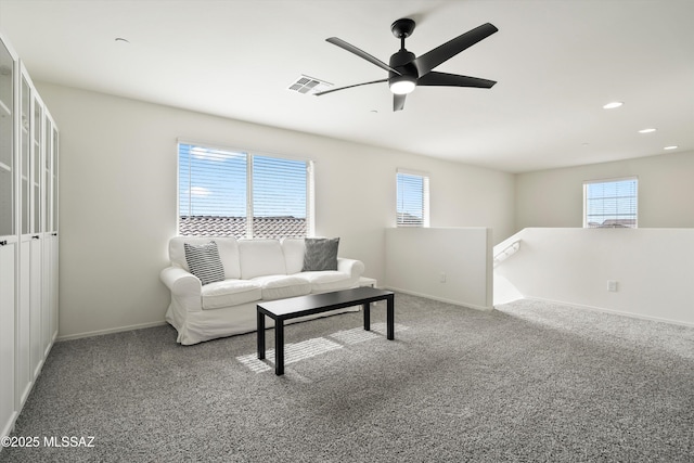 carpeted living room with recessed lighting, visible vents, ceiling fan, and baseboards