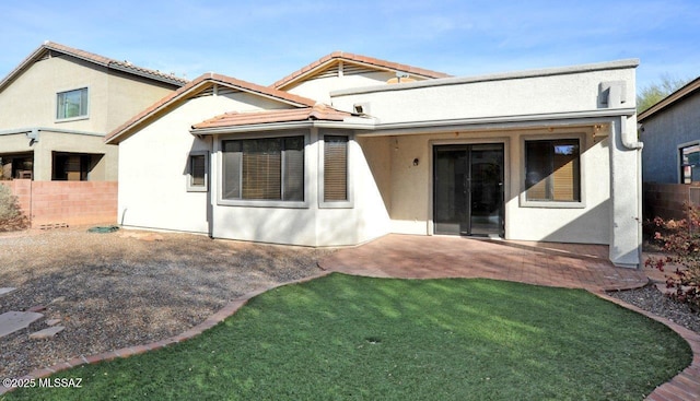 back of property with a patio area