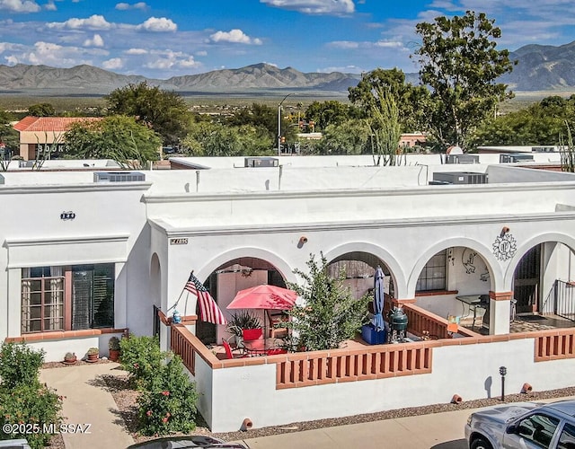 back of property featuring a mountain view